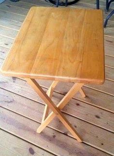 a wooden table sitting on top of a wooden floor