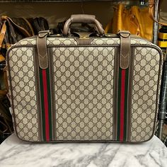 Includes Digital Coa Certificate Of Authentication Clean Coated Canvas Exterior Leather Detailing, Handles, Buckles, Luggage Tag Clean Interior With Original Gucci Straps Built-In Built-In Gucci Lock (No Key, But Doesn’t Need A Key To Open) Smooth Working Zipper Bottom Feet With Some Discoloration Corners Have No Wear Overall In Very Good Pre-Owned Condition Rare Item Approximate Measurements: 19” L X 14” H X 6.5” D Handle Drop: 2” Item Will Go To Poshmark For Authentication Prior To Delivery. Gucci Luggage Travel, Travel Trunk, Luggage Case, Leather Detailing, Gg Monogram, Luggage Tag, Luggage Tags, Vintage Gucci, Travel Luggage