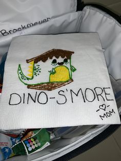 there is a bag that has some kind of food in it with the words dino - s'more on it