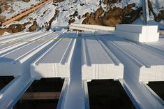 the roof of a building with snow on it