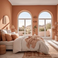 an orange bedroom with arched windows and white bedding