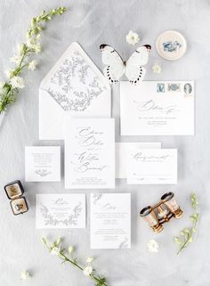 the wedding stationery was done in blue and white, with an elegant butterfly theme