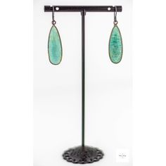 Indulge in the beauty of the ocean with these stunning, shimmering seafoam green and aqua blue Amazonite drop earrings. The bright bright Amazonite perfectly complements the gray niobium ear wires, creating a mesmerizing contrast of colors. Be charmed by the alluring beauty of these limited edition sea green amazonite drop earrings. Each gemstone features a unique striated pattern in shades of aqua blue, sea green, lemon yellow, and white, reminiscent of the ocean's natural beauty. Measuring 1 i Bohemian Amazonite Earrings As Gift, Faceted Turquoise Amazonite Jewelry, Bohemian Amazonite Earrings For Gifts, Dangle Earrings With Amazonite And Natural Stones, Amazonite Natural Stone Earrings For Gifts, Green Jade Earrings For Healing, Turquoise Dangle Earrings With Amazonite, Turquoise Amazonite Earrings For Gift, Turquoise Jade Earrings With Natural Stones