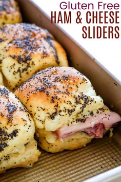 ham and cheese sliders in a baking pan with poppy seed sprinkles