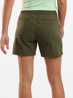 the back view of a person wearing green shorts