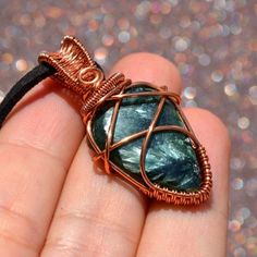 "Hand-made Unique wire-wrapped pendant, made with a Serpentine Natural Stone wrapped in non-tarnish coated Copper Wire. This wire has been coated to stop the tarnishing process of the copper. Please take the utmost care not to scratch this coating, as tarnishing will occur. Pendant size: 1.65\" x 0.83\" (4.2cm x 2.1cm ) The pendant comes with a velvet leather cord. All photos are made with natural daylight. Please note that in reality, colors of the jewelry may look slightly different than colors in photos on your screen.\"" Wire Pendant Necklace As A Gift, Wire Pendant Necklace For Gift, Unique Wire Jewelry Gift, Unique Wire Jewelry As A Gift, Unique Wire Jewelry For Gifts, Hand Wrapped Wire Necklaces For Gifts, Hand Wrapped Wire Necklace For Gift, Gift Necklace With Wire-wrapped Design, Wire Wrapped Stone Jewelry