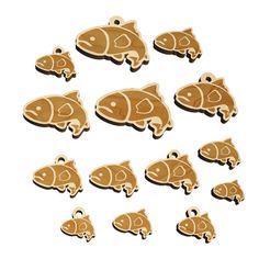 small wooden fish charms in various shapes and sizes on a white background with clippings