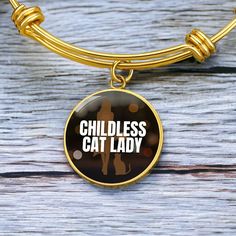 Get our Childless Cat Lady Bracelet today and be amazed by its quality and style! Made with durable surgical steel and the option for 18k gold finish, this jewelry item is the ultimate keepsake for yourself or your loved ones. Plus, we offer a 100% Happiness Guarantee - if for any reason you're not completely satisfied, just let us know and we'll make it right. Your satisfaction is our top priority. Product Dimensions➜ Luxury Bangle: 7-9" (18-22.75cm). This bangle features a stretchable design that allows it to expand as you slide it onto your wrist, then it effortlessly returns to its original shape.➜ Circle Pendant: 23.5mm x 23.5mm. Stainless Steel Bracelet Jewelry As Best Friend Gift, Stainless Steel Bracelet Jewelry For Best Friend, Metal Jewelry For Mother's Day And Best Friend Gift, Stainless Steel Bracelet For Best Friend, Metal Jewelry For Mother's Day Birthday Gift, Mother's Day Jewelry Gift For Best Friend, Stainless Steel Round Pendant Jewelry For Best Friend, Gold Stainless Steel Charm Bracelet, Metal Jewelry For Birthday And Mother's Day