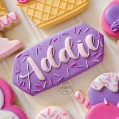 decorated cookies and pastries with the word addie spelled in frosting on them