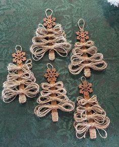 four small christmas trees made out of twine