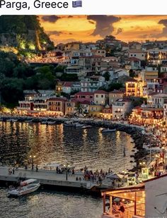 the city is lit up at night by the water with boats and people on it