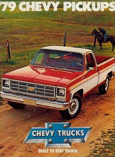 an old chevrolet pickup truck parked on a dirt road with a horse in the background