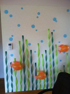 the wall is decorated with fish and bubbles