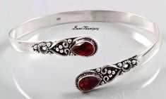 Stunning Red Garnet Gemstone Bangle, 925 Sterling Silver Bangle, Adjustable Bangle, Handmade Silver Bangle, Stylish Bangle, Bangle For Women Welcome in My Shop Description Metal :- 925 Sterling Silver Style :- Bangle ############################################################################################################################################ Benefits Of Garnet Gemstone Benefits of Wearing Garnet Gemstone It protects the wearer from negativity and evil thoughts. It induces passion, fire, energy, stability, and is believed to bring good luck in love and relationships. Garnet is a stone meant to bring success in life and helps to achieve the goals set in life by its possessor. ####################################################################################################### Garnet Bangle Jewelry Gift, Garnet Bangle Jewelry As Gift, Handmade Ruby Bangle Bracelet, Red Ruby Bangle As Gift, Handmade Adjustable Red Sterling Silver Bracelet, Red Sterling Silver Anniversary Bracelet, Handmade Red Bracelet For Anniversary, Elegant Handmade Red Bangle, Elegant Red Handmade Bangle