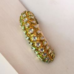 - Traditional Indian design - Gold plated hypoallergenic , nickel and lead free - Kundan gemstone with green detailing - Elegantly boxed to be given as a gift, or easily stored to be ready for your next occasion Kundan Bangles, Traditional Indian, Indian Design, Bangle Bracelets, Jewelry Bracelets, 18k Gold, Gold Plate, Bangles, Plating