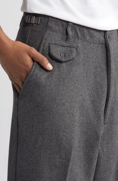 A roomy fit emphasizes the vintage spirit of pants tailored from a softly felted wool blend with flat-front construction and an easy, wear-everywhere feel. Exclusive retailer 30 1/2" inseam; 21" leg opening; 13 1/2" front rise; 20 1/2" back rise (size 32) Zip fly with button closure Front slant pockets; back button-welt pockets Adjustable buckle side tabs 50% wool, 40% polyester, 10% other fibers Machine wash, tumble dry Imported Modern Wool Bottoms With Pockets, Luxury Wool Pants With Welt Pockets, Solid Full-length Wool Pants, Mens Wool Pants, Men’s Wool Pants, Military Pants, Pants Details, Winter Pants, Sweet Style