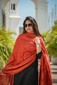 Red Kani Jamawar dupatta in silk fabric has been meticulously woven into rich & traditional floral motifs and vibrant colour palette to suit all eyes. This gorgeous and rich Kashmiri Pashmina Silk Dupatta is suitable for any celebration or gathering. Be it a wedding function or a festive celebration, it adds colour and vibrance to your outfit as you team it with salwar suit/ kurta set for an ethnic look or simply don with any modern outfit for that contemporary look. Colour: Red Craft: Kani Weave Fabric: Silk Dimensions:                 L - 2.45 m                 W - 0.95 m Elegant Red Pashmina Shawl In Traditional Drape, Elegant Red Pashmina Shawl, Traditional Red Pashmina Dupatta Shawl, Traditional Red Pashmina Shawl Dupatta, Red Bollywood Shawl With Cutdana, Bollywood Style Red Shawl With Cutdana, Red Traditional Shawl, Red Dupatta Shawl In Traditional Drape, Red Shawl-shaped Dupatta With Pallu