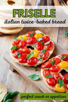 two fresh breads with tomatoes and basil on them