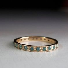 a close up of a wedding ring on a table