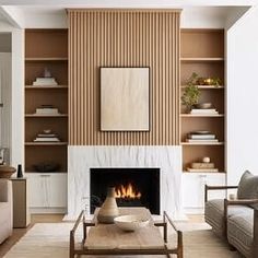 a living room filled with furniture and a fire place