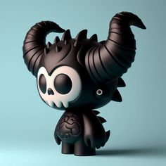 a black and white figurine with horns on it's head, sitting in front of a blue background