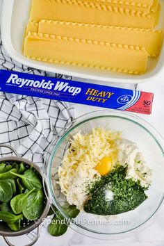 ingredients to make cheese and spinach salad laid out on a table