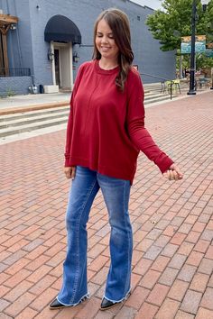 Bring this top to me! ​ ​This top features a solid long sleeve sweater top featuring a round neckline, exposed seams for added detail, ribbed cuffs, a ribbed bottom band and is a high-low design.! ​ ​Make this your #OOTD ​ ​ Denim Sneakers, Exposed Seams, Ootd Style, Loungewear Sets, Kids Play, Bring It, Merlot, Mom Style, Clothes Gift