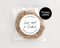 a cookie in a plastic bag with the label printed on it that says, all you need is love and a cookie