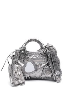 silver-tone lambskin patent finish metallic effect stud detailing front zip-fastening pocket mirror tag heart motif two top handles adjustable shoulder strap top zip fastening main compartment Heart Mirror, Balenciaga Logo, Heart Motif, Bag Silver, Loafer Mules, Strap Tops, Braided Leather, Casual Bags, Leather Handle