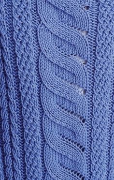 a blue knitted sweater with holes in the middle and two rows of stitches at the bottom