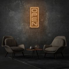 two chairs and a table in front of a wall with the word roma on it