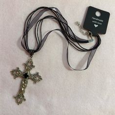 Statement Floral Cross Pendant On A Black Ribbon Necklace. Add A Touch Of Gothic Beauty To Your Look With This Vintage-Style Silver Tone Cross Necklace. The Necklace Features A Charming Floral Design And A Big Punk Cross That Hangs On An Adjustable Black Ribbon. Perfect For Any Occasion, This Necklace Is Ideal For Engagement, Wedding, Anniversary, Birthday, Christening, Confirmation/Communion, Valentine's Day, Father's Day, Mother's Day, Christmas, Graduation, Or Just For Yourself. The Necklace Black Metal Cross Pendant Necklace, Black Metal Costume Jewelry Necklace, Black Cross Pendant For Formal Occasions, Formal Jewelry With Black Ribbon, Black Necklace With Ribbon For Gift, Adjustable Black Cross Pendant Jewelry, Black Metal Cross Jewelry, Black Metal Cross Pendant Jewelry, Black Adjustable Cross Pendant Jewelry