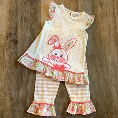 Rare Editions 2-Piece Bunny Outfit. Color Oatmeal With Tan Polka Dots/Stripes And Pink Floral. Sleeveless Top Has A Beautiful Bunny Appliqu/Gold Thread On Front And Buttons To Back. Pink Pompom Edging. Pull-On Pant. 58% Cotton, 38% Polyester And 4% Spandex. Ruffles 100% Cotton. Purchased At Dillards Size 6. New With Tags. Playful Matching Sets For Spring, Playful Spring Matching Sets, Playful Cotton Sets For Easter, Playful Playwear Sets For Spring, Playful Spring Playwear Sets, Playful White Sets For Spring, Cute Cotton Sets For Easter, Cute Fitted Easter Sets, Playful Sets For Easter Playtime