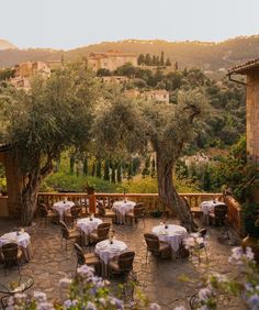 an outdoor dining area with tables and chairs