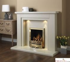 a white fireplace with an electric fire in it