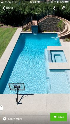 an aerial view of a swimming pool in a backyard