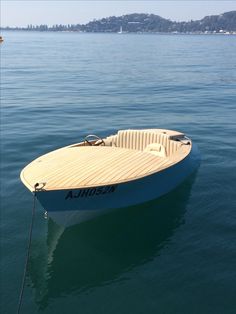 a small boat floating on top of the water