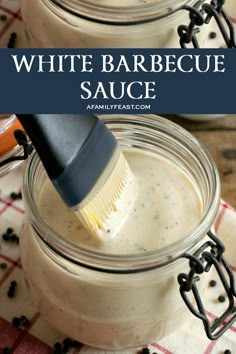 two mason jars with white barbecue sauce in them