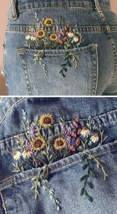 the back of a pair of jeans with flowers embroidered on it and in between them