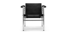 a black leather chair with chrome legs and armrests on a white background photo