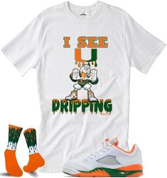 Custom Shirts to match the Jordan 5 Hurricanes Sizing Chart is available Since all items are made to order, all sales are final. Please use the sizing chart for assistance with selecting the correct size. Since all items are custom and made to order we do not accept return or do exchanges. This shirt is available in kids and adults We try to ship all orders out ASAP But There is a 1-3 business day handling time. Washing instructions: 1. Cold/warm water 2. Turn item inside out 3. Do not bleach or use oxy clean detergent. 4. Hang and Air dry recommended We also do special request for any hard to match sneaker you may have. Message us Green And Orange 5s Outfit, Clean Detergent, Saint Marys, Matching Jordans, Jordan 5, Sizing Chart, Green And Orange, Washing Instructions, Air Dry