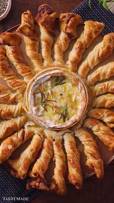 a platter filled with croissants and dip