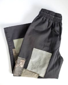 "Classic black pants with custom patches added by me! - upcycled unisex black pants - cotton/poly blend - side/back pockets - side cargo pockets added - length cropped - elasticized waist with drawstring - upcycled fabric patches added Waist - 26\" (stretches up to 28\" comfortably) Hip - 22\" Front rise - 12\"  Inseam - 23.5\"  Please read shop policies before purchasing :-) www.instagram.com/jool73 www.facebook.com/joolupcycles" Patch Cargo Pants, Black Relaxed Fit Bottoms With Patchwork, Relaxed Fit Black Bottoms With Patchwork, Black Patchwork Bottoms With Relaxed Fit, Casual Wide Leg Reworked Pants, Casual Upcycled Cotton Bottoms, Reworked Wide Leg Cotton Pants, Patch Work Cargo Pants, Black Relaxed Fit Patchwork Bottoms