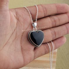 "Black Onyx Heart Pendant, 925 Sterling Silver Pendant Necklace, Silver Black Onyx Pendant, Handmade Pendant Jewelry, Birthstone Gift Pendant Shop Link: https://www.etsy.com/shop/MaaShabashibaJewell?ref=seller-platform-mcnav Items Details: Handmade item Gemstone:- Natural Black Onyx Gem Shape:- Heart Gem Color: Black Item:- Pendants Metal:- Sterling Silver Metal priority :- 92.5% Manufacturing:- India Please note that there Can be slight variations in stone texture and color shades in the actual product that you receive. The stone quality or grade will be the same. Because We Use Natural Stones And All Natural Stones Are Not Of Same Textured. All Our Jewelry Is 925 Stamped. M A T E R I A L Why Wear Black Onyx:- Black Onyx is the birthstone for Leo. It is the stone of protection. This elega Black Sterling Silver Necklace For Anniversary, Black Sterling Silver Jewelry For Valentine's Day, Black Sterling Silver Heart Necklace For Anniversary, Black 925 Stamped Pendant Jewelry, Black Sterling Silver Jewelry With Heart Charm, Silver Oval Onyx Necklace, Handmade Black Heart-shaped Jewelry, Handmade Black Heart Pendant Necklace, Onyx Oval Pendant Jewelry For Gift