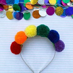 This brightly coloured headband will see you all through the festival season. The six woollen pom poms each (measuring roughly 4cm) represent the colours of the rainbow which also makes it the perfect hair accessory for wearing to Pride festivals. The pom poms are secured to a silver metal headband. This item was lovingly handmade by me in a smoke free home which does contain one small dog although Ziggy is not allowed into my studio.  I make every effort to accurately represent each product's colour but variances may occur due to differences in computer monitor/tablet/mobile device settings. I'm a sociable person, so come and find me on:  Instagram: https://www.instagram.com/rocknrollsouldesigns/?hl=en Facebook: https://www.facebook.com/Rock-n-Roll-Soul-Designs-582662068572988/ Pinterest: Whimsical Adjustable Multicolor Headband, Fun Multicolor Headband For Gift, Fun Multicolor Headband As Gift, Fun Multicolor Headband For Gifts, Fun Multicolor Hair Accessories With Matching Headband, Playful Multicolor Hair Accessories With Matching Headband, Multicolor Hair Accessories For Carnival Party, Whimsical Multicolor Hair Accessories With Matching Headband, Playful Multicolor Headband For Party