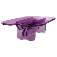 a purple glass coffee table with two legs