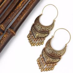 Gypsy Goddess Boho Earrings Bohemian Drop Earrings With Fish Hook, Bohemian Brass Drop Earrings, Bohemian Antique Gold Brass Earrings, Bohemian Brass Drop Danglers, Bohemian Brass Danglers, Bohemian Bronze Earrings With Intricate Design, Bohemian Danglers With Intricate Design, Bohemian Drop Earrings With Antique Finish, Traditional Gold Tassel Festival Earrings