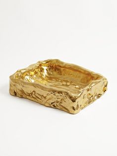 a gold plate on a white background