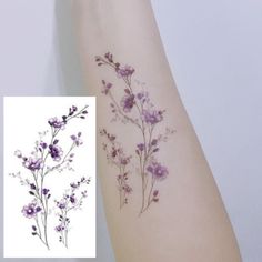 an arm with some flowers on it and the same tattoo is shown in purple colors