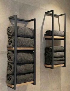 two shelving shelves with towels on them in a bathroom